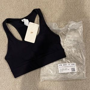FABLETICS NWT on-the-go medium impact sports bra. Racerback + back phone pocket